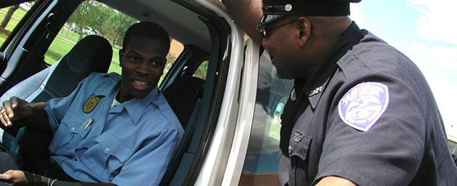 police officer talking to another officer in car